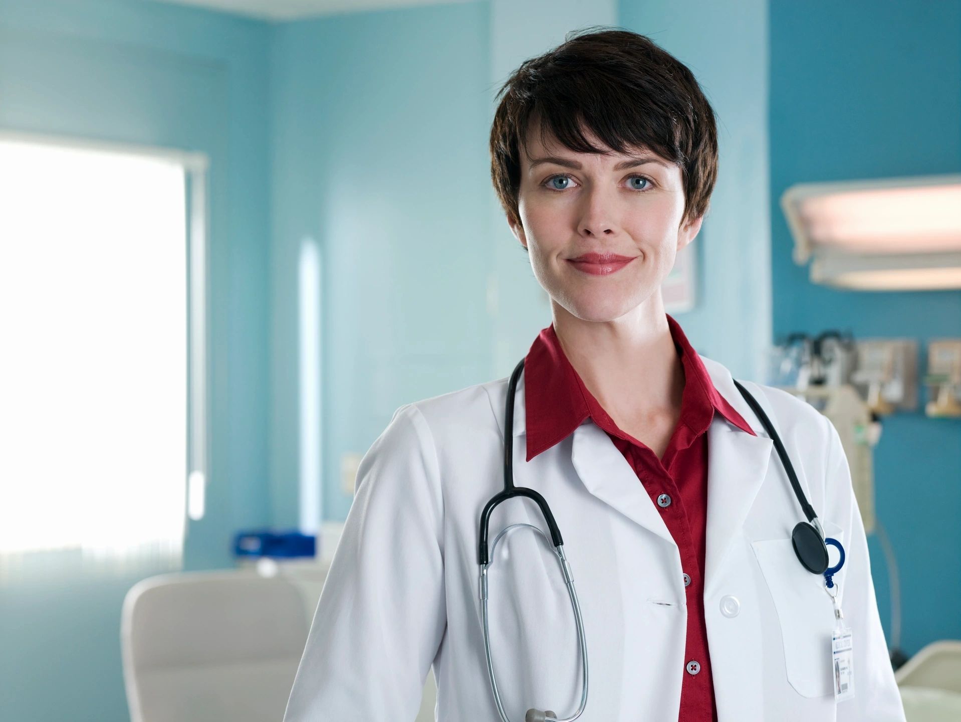 Female doctor with white coat and stethoscope